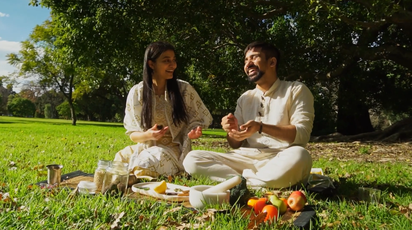 Couple practicing Ayurvedic food wisdom outdoors